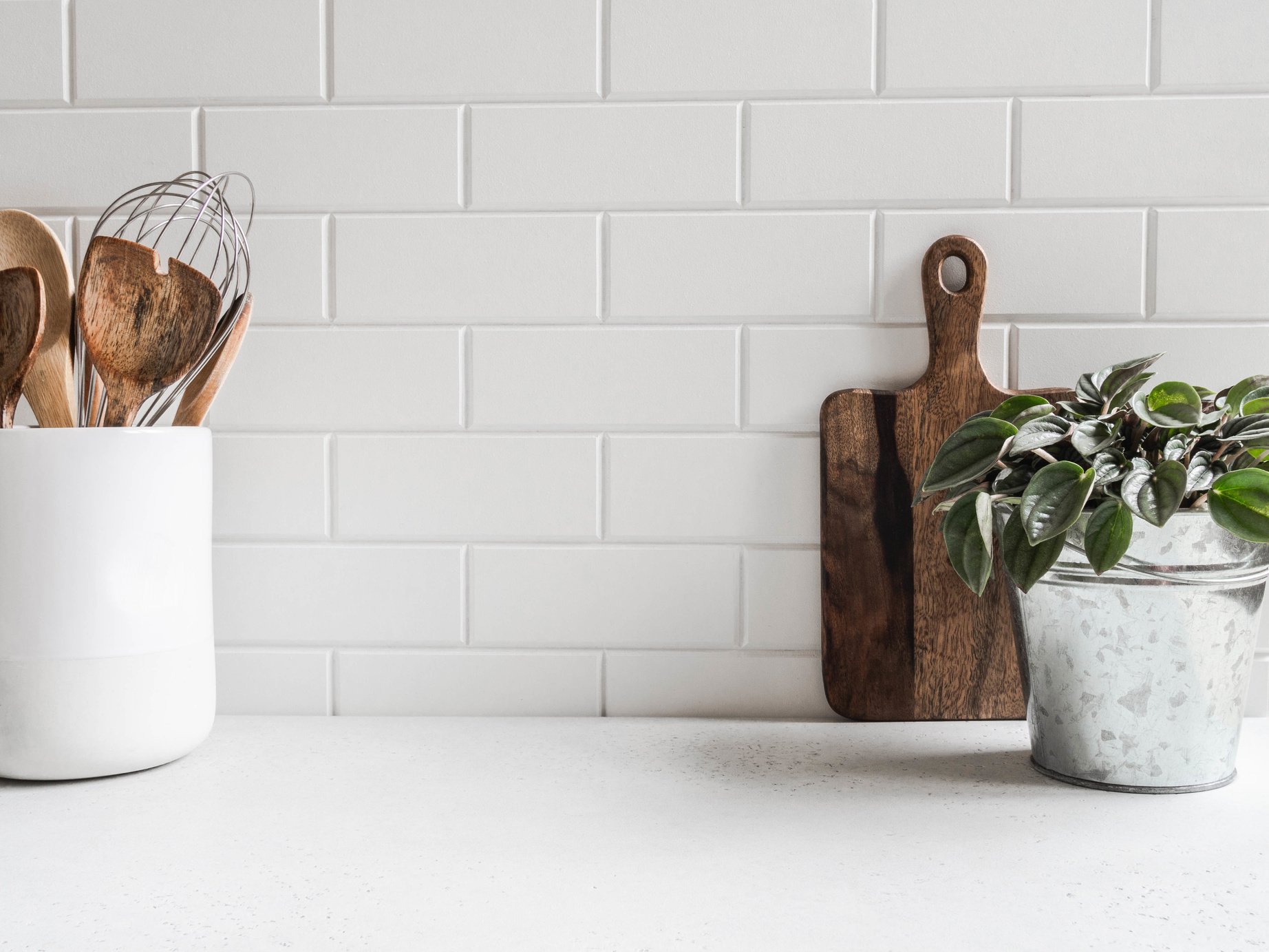 Kitchen background with kitchen utensils and houseplant